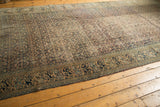 Antique rug detail: Classic Mahi Mahi and turtle main border with worn Herati field.