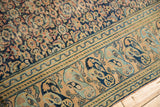 Distressed antique Khorassan rug: worn navy Herati field, beige Mahi Mahi and turtle border.