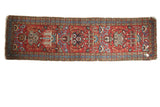 Vintage Heriz hand-knotted rug runner, cherry red field, blue and green plant designs.