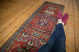 Cherry red field of the Vintage Heriz runner with sky blue vinery and aged green blossoms.