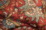 Hand-knotted pile texture with cherry red, sky blue, and oxidized copper green vinery motifs.