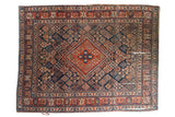 Vintage Joshegan carpet, cherry red medallion, navy blue field, intricate lattice. 7'11