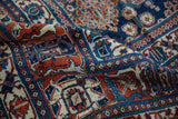 Vintage Joshegan carpet, intricate paneled lattice with Gardens of Paradise motif, cherry red, navy, worn texture.