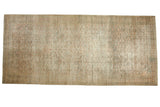 Antique distressed Khorassan runner, faded Herati pattern, subtle medallion, muted ivory and green.