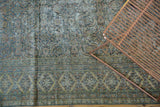 Distressed antique Khorassan runner showing ocean green Herati motif and patterned border.