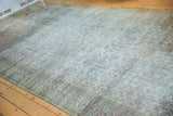 Aged texture and faded Herati pattern on an antique distressed Khorassan carpet runner.