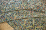 Distressed Herati motif with even wear and time-softened ocean green and sand tones.