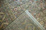 Distressed Khorassan rug with even wear to foundation, showing secured side.