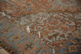 Low pile and distressed wear on an antique Karaja rug with copper, silver, and beige geometric motifs.