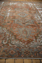 Angled view showcasing the character-rich wear and geometric pattern of a distressed Karaja carpet.