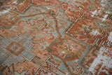 Distressed low pile and exposed knot heads on an antique Persian Karaja carpet.