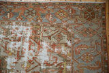 Hard areas of wear on a Persian Karaja carpet showing the foundation under copper and silver designs.
