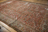 Corner detail of distressed Mehrivan rug, showing localized wear and faded blush red serrated leaves.
