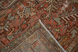 Localized hard distress on brick red pile with hand-knotted Mehrivan rug foundation.
