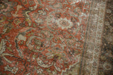 Distressed vintage Mahal carpet pattern showing brick red, oxidized silver, and charcoal with intertwined floral motifs.