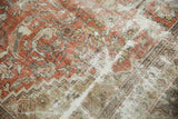 Distressed Mahal rug pattern with hard wear, exposed foundation, terra cotta, and beige.