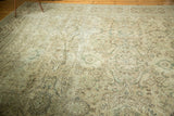 Distressed vintage Mahal carpet showcasing delicate floral vinery in ivory, silver beige, and soft green.