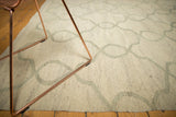 Hand woven Kilim carpet texture, repeating Moroccan-inspired vine pattern in silver and ivory.