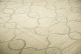 Pale slate grey Moroccan tile-inspired vines on a woven silver ivory Kilim.