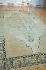 Distressed Oushak runner corner showcasing charcoal, silver, and beige border motifs.