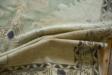 Distressed vintage Oushak runner, folded texture shows faded beige, silver, and charcoal patterns.