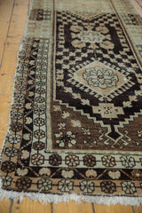 Distressed Oushak rug with quatrefoil medallion, blossomed florals in ivory and brown.