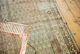 Distressed Malayer runner, showing time-softened ocean green, terra cotta, and beige patterns.