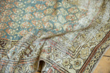 Distressed Malayer runner showing aged texture and geometric border motifs in ocean green, terra cotta.