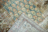 Folded vintage Malayer runner, showing hand-knotted back and distressed ocean green boteh pile.