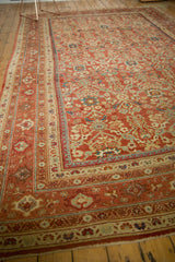 Corner detail of antique Persian Mahal rug with terra cotta borders, germinating plant motifs.