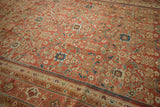 Antique Persian Mahal carpet detail, terra cotta field with indigo and sky blue floral lattice.