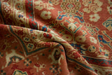 Antique Mahal carpet's hand-knotted pile, displaying terra cotta tones and curvilinear botanical motifs.