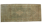 Distressed vintage Malayer carpet with dramatic medallion and Herati motif in muted blues and ivory.