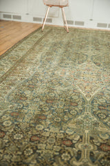 Distressed Malayer carpet with faded blue Herati motif and subtle antique ivory tones.