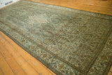 Detail of distressed Malayer carpet, soft denim blue Herati motif and antique ivory tones.