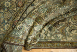 Distressed vintage Malayer carpet, folded to reveal Herati motif and intricate borders.