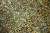 Textural Herati motif on vintage distressed Malayer, with denim blue and ivory tones.