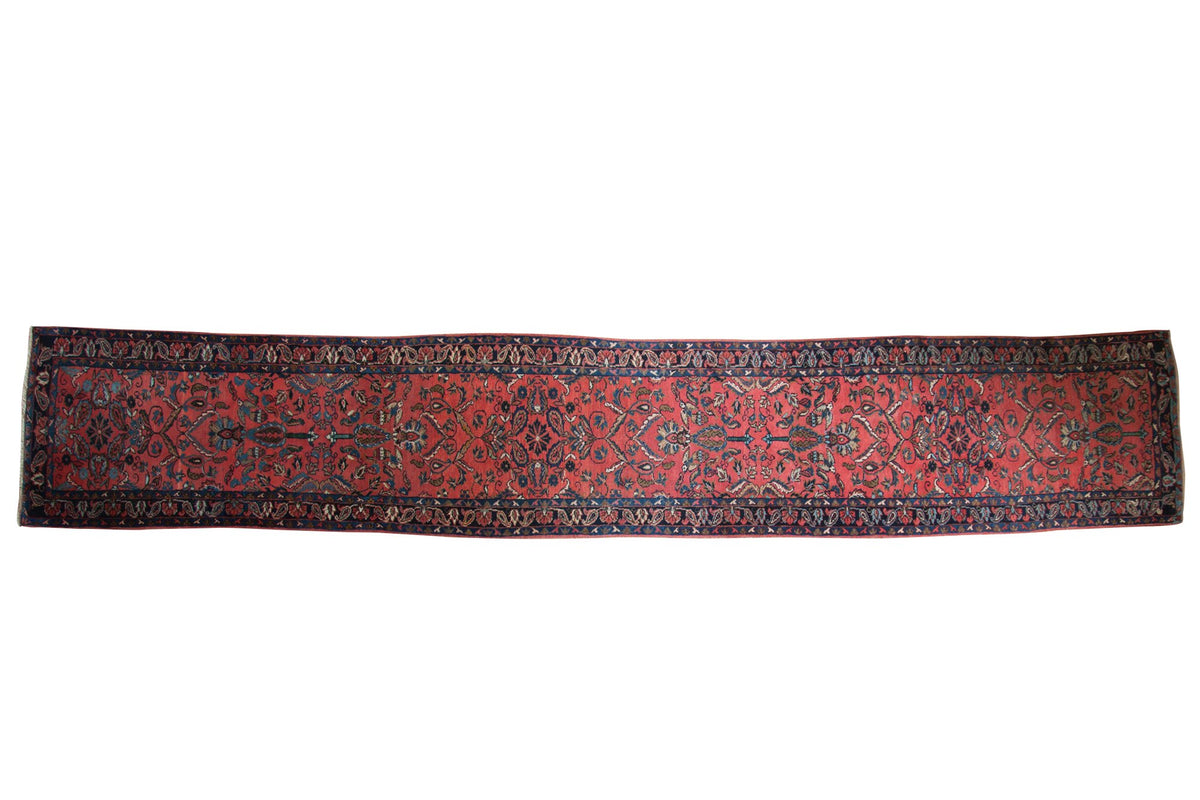 Vintage Lilihan runner with an allover tree of life motif on a blush field bordered in navy blue.