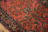 Angled view of the even low pile and boteh motifs on a vintage Lilihan runner.