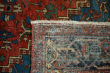 Antique Persian Heriz rug's fringe and finely hand-knotted reverse foundation.