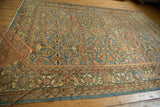 Distressed vintage Mahal rug, showing pale denim blue, ivory, and blush scrolling floral field pattern.