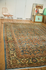Distressed vintage Mahal rug corner, showing pale blue, ivory scrolling floral motifs and even wear.