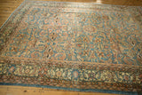 Distressed vintage Mahal carpet border with pale denim blue and blush scrolling floral patterns.