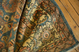 Vintage Distressed Mahal rug pile showing scrolling denim blue and blush floral designs.