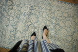 Distressed vintage cotton Agra runner with faded blue and ivory floral motifs, low pile.