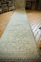 Allover dusty blue floral motifs on ivory with distressed low pile on vintage cotton Agra runner.