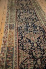 Antique Malayer rug detail: Geometric border meets navy field with rose and ivory paisley.