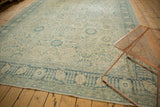 Distressed blue palmettes and delicate vinery on a vintage Tabriz carpet border.