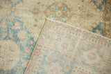 Distressed vintage Sivas carpet pile with worn floral motifs, revealing hand-knotted foundation.