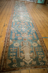 Distressed Malayer runner pile showing worn dusty blue and antique ivory patterns.